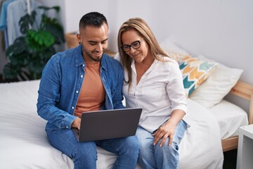 Poster - Man and woman mother and son using laptop at bedroom