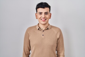 Canvas Print - Non binary person standing over isolated background with a happy and cool smile on face. lucky person.