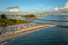 Aerial View Of Nokomis Beach In Sarasota County, USA. Many People Enjoing Vacation Time Swimming In Gulf Water And Relaxing On Warm Florida Sun At Sunset