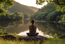 Person Meditating In Nature With An Emphasis On Tranquility, Mindfulness, And Relaxation
