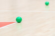 © Augustas Cetkauskas - Training ball on hardwood court floor. Basketball, futsal, handball and volleyball practice. Game equipment Horizontal sport theme poster, greeting cards, headers, website and app