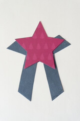 Sticker - machine-cut scrapbook paper star with stylized gray paper ribbons