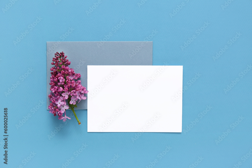Blank cards with lilac flowers on blue background
