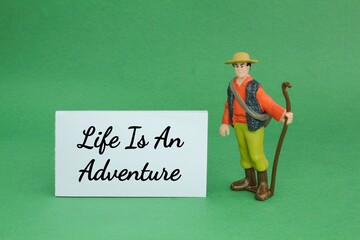 a traveler with the quote life is an adventure. the concept of life's adventure
