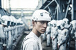 © wetzkaz - disappointed young man is worker of military type union or company, sad depressed or motivationless scared face expression, protective helmet and suit. Generative AI