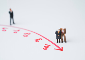 Miniature figure young man and Couple Senior Pensioners standing on red arrow with age for wealth financial planning ,money saving and life insurance of retirement concept.