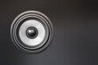 audio speaker on grey metalic background