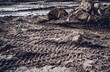 Excavator tire tracks footprint on construction road site