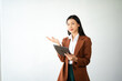 © Nuttapong punna - Portrait photo of young beautiful Asian woman feeling happy and holding smart phone, tablet and laptop with black empty screen on white background product presenting concept..
