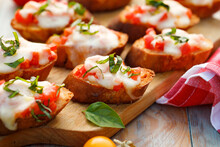 Cheese Tomato Bruschetta With The Addition Of Fresh Basil, Focus On The Toast Inside 