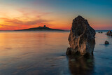 Fototapeta Morze - Sun setting behind the islet of Isola delle Femmine, province of Palermo IT