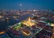 © tampatra - Aerial top view of Temple of Dawn or Wat Arun statue and Chao Phraya River, Bangkok, Thailand in Rattanakosin Island in architecture, Urban old town city, skyline at sunset.