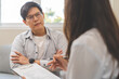 © KMPZZZ - Psychology, depression. Sad, suffering asian young man, male consulting with psychologist, psychiatrist while patient counseling mental with doctor hand taking notes at clinic. Encouraging, therapy.