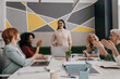 © gstockstudio - Group of mature businesswomen applauding and smiling while having meeting in the office