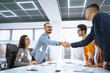 © maxbelchenko - Close Up of business people shaking hands after contract meeting. Business etiquette, congratulation, merger and acquisition concepts.