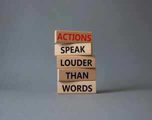 Wall Mural - Actions speak louder than Words symbol. Wooden blocks with words Actions speak louder than Words. Beautiful grey background. Business and Actions concept. Copy space.