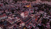 Aerial View Of Granada City, Albaicin District At Dusk, Old Moorish Quarter Of The City, Located On A Hill Facing The Alhambra. Andalusia, Spain