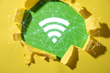 Wall Mural - torn paper with a wireless technology symbol. wifi symbol with a network connection