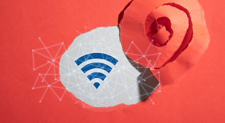 Wall Mural - torn paper with a wireless technology symbol. wifi symbol with a network connection