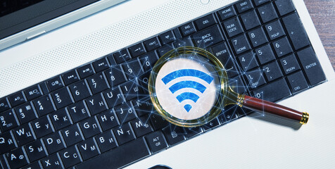 Wall Mural - magnifying glass with a wireless technology symbol. wifi symbol with a network connection