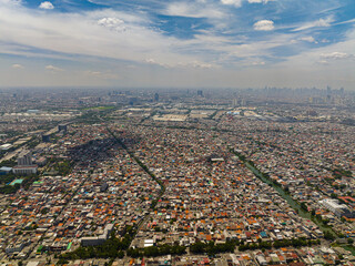 Poster - Aerial drone of slums and skyscrapers in Jakarta. City Landscape. Indonesia.