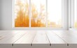 canvas print picture - Weißer Holztisch in einer Küche mit Blick auf das Fenster, herbstliche Bäumen im verschwommenen Hintergrund, helles Tageslicht, Platz für Warenpräsentation oder Text, Generative AI