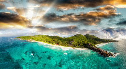 Wall Mural - Panoramic sunset aerial view of La Digue Island in Seychelles, Grande and Petite Anse Beaches