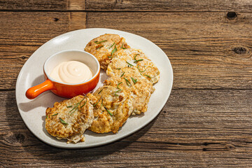 Wall Mural - Hake fillet fried in batter. Sauce, fresh rosemary. Vegetarian healthy food concept