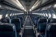 © Alina - Interior of an empty modern airplane cabin in blue color, Generative AI