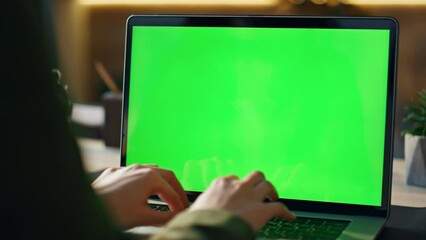 Wall Mural - hands typing greenscreen laptop at office closeup. freelancer working chroma key