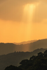 Wall Mural - Divine glow through the clouds of the evening warm sun. Concept of peace and happiness.