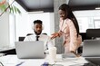 © bolaji - Young african american people in business suits working on laptop by desk at office