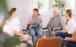 © JackF - Women of different ages in casual clothes communicate on chairs in circle in office