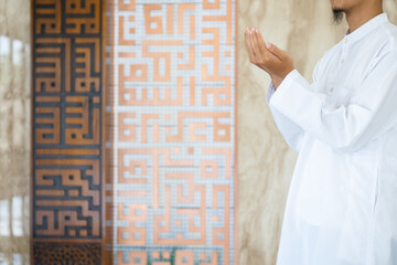 Hand of muslim people praying. Muslim islam man in white session lift two hand for praying. Concept for islamic pray, Ramadan, Eid al Fitr