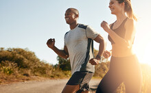 Smile, Running And Health With Couple In Road For Workout, Cardio Performance And Summer. Marathon, Exercise And Teamwork With Black Man And Woman Runner In Nature For Sports, Training And Race