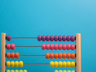 Wooden abacus on a blue background, Wooden abacus for children.