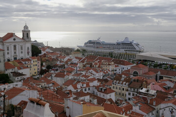 Luxury liner cruiseship cruise ship Sirena, Regatta, Insignia or Nautica in port of Lisbon, Portugal during Mediterranean cruising with city skyline