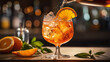 Pouring in Aperol Spritz in a glass