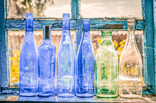 Blue Empty Bottles On Window In Old House