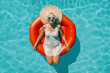 © ADDICTIVE STOCK - Top view of Generative AI illustration of elderly gray haired woman in summer dress sunglasses and straw hat relaxing on red inflatable ring mattress while swimming in pool during vacation