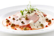 Vitello tonnato - cold veal dish with tuna and caper sauce on white plate. Generative AI.
