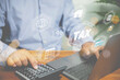 © Chaiwat - Businessman use a calculator calculate revenue for refund value tax and using laptop calculate cost and profit online for investment real estate . Investment, financial, and business concept.
