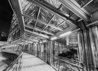 Poster - Modern pedestrian walkway and traffic in downtown of Hong Kong city at night