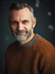 Wall Mural - Portrait of a handsome middle-aged man in a sweater.