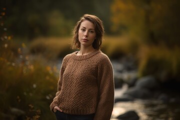 Wall Mural - Portrait of a beautiful young woman in the autumn forest. Soft focus.