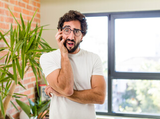 Wall Mural - young adult crazy man with expressive pose at a modern house interior