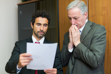 Sticker - Businessmen reading a document