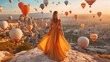Young beautiful woman wearing elegant long dress in front of Cappadocia landscape at sunshine with balloons in the air. Generative Ai