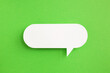 canvas print picture - paper speech bubble on green background