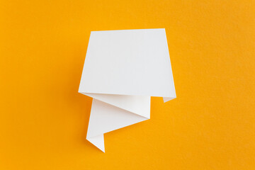 paper speech bubble on yellow background